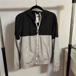 Black and grey windbreaker